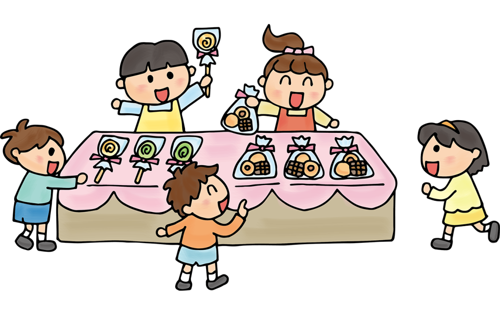 「バザーでお菓子を配る子供たち」のフリーイラスト